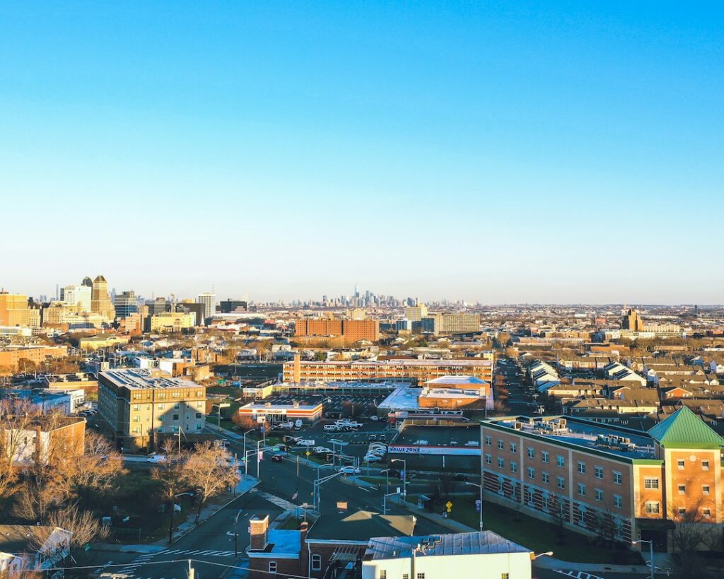 Aerial daytime view of dense urban blocks with mid-rise and high-rise apartment and office buildings