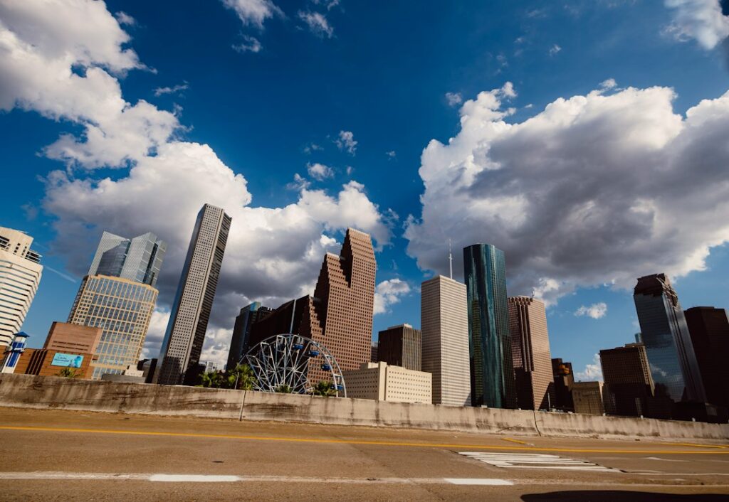 Downtown Houston, Texas skyline of high-rise towers under a clear sunny sky