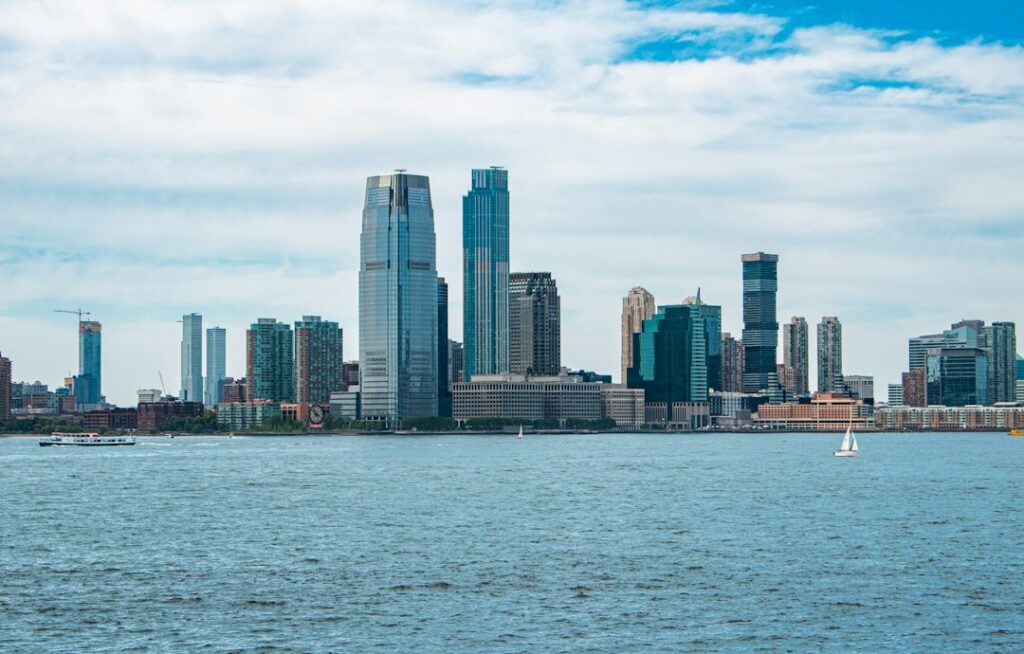 Jersey City, New Jersey waterfront skyline of residential and office towers on a summer afternoon