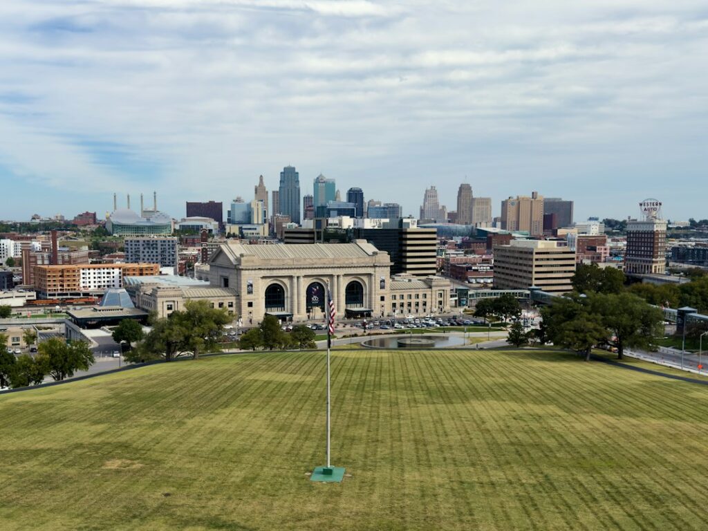 Kansas City, Missouri skyline rising behind Union Station and a wide green lawn