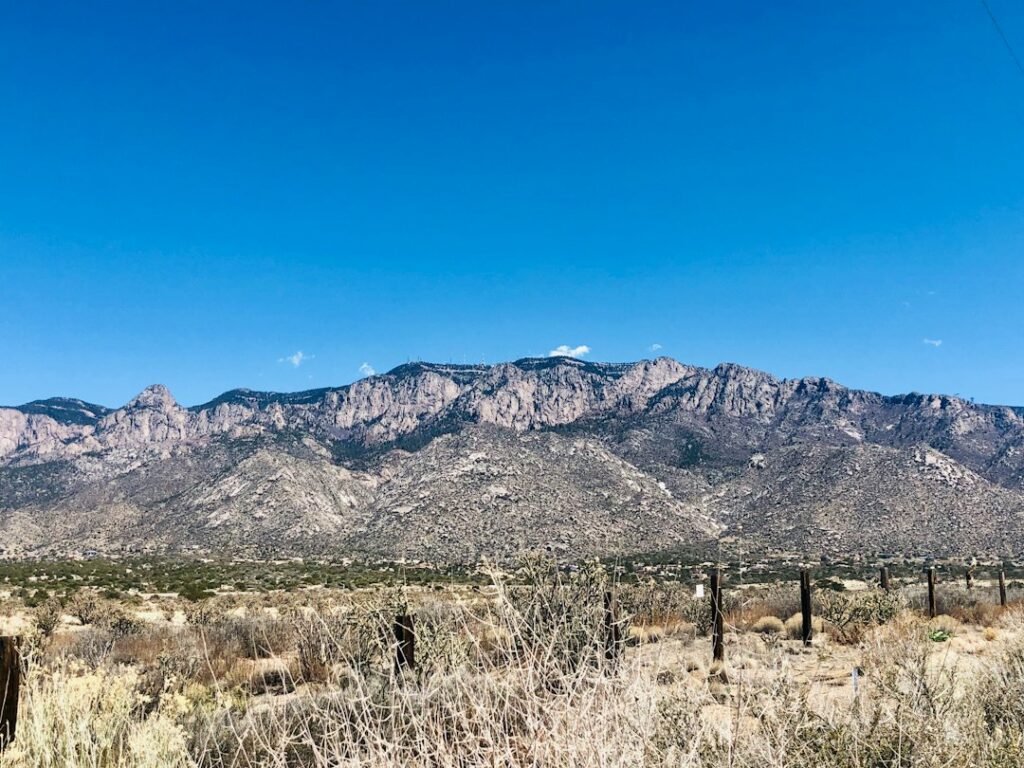 View of the Sandia Mountains rising above Albuquerque, New Mexico, under a clear sky